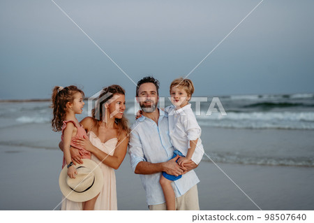 Happy family with little kids enjoying time at sea in exotic country. 98507640
