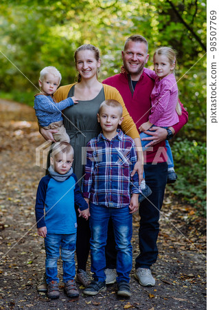 Portrait of big happy family with kids in a forest. 98507769