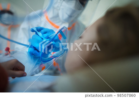 Close-up of little girl with infection disease lying in hospital room. 98507860