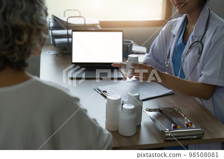 Doctor talking with elderly asian woman. Female primary care physician having conversation with older woman. Elderly Healthcare Doctor talking with elderly asian woman. Female primary care physician having conversation with older woman. Elderly Healthcare 98508081
