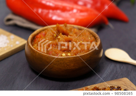 Balkan sauce ajvar and ingredients for its preparation. Serbian traditional food. Balkan sauce ajvar and ingredients for its preparation. Serbian traditional food. 98508165