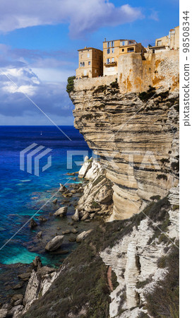 Bonifacio - splendid coastal town in south of Corsica island, view of houses hanging over rocks. France. Bonifacio - splendid coastal town in south of Corsica island, view of houses hanging over rocks. France. 98508344
