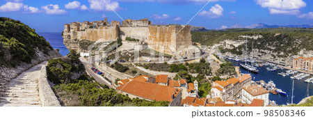 Bonifaccio town on the rocks, Corsica island. view of castle and marina with sailing boats Bonifaccio town on the rocks, Corsica island. view of castle and marina with sailing boats 98508346