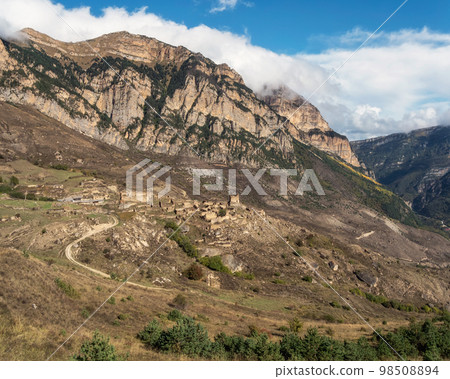 Abandoned ethnic aul. Old abandoned ghost town of Digoria region. The ancient city under the mountain. Excavations of the historical heritage of ancient history. North Ossetia, Russia. 98508894