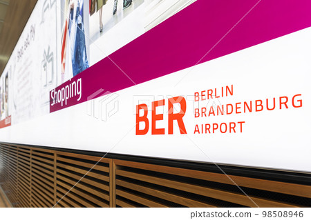Berlin Brandenburg airport - July 24th, 2022: Close-up view BER code Berlin Brandenburg airport logo inside new terminal building. Tax free shopping ad. Dutyfree retail store advertisment banner 98508946