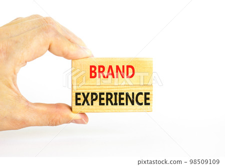 Brand experience symbol. Concept words Brand experience on wooden blocks. Beautiful white table white background. Businessman hand. Business branding and brand experience concept. Copy space. 98509109