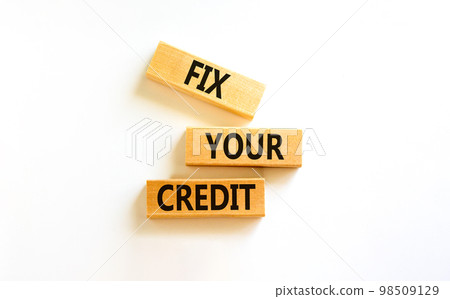 Fix your credit symbol. Concept words Fix your credit on wooden blocks on a beautiful white table white background. Business, finacial and fix your credit concept. Copy space. Fix your credit symbol. Concept words Fix your credit on wooden blocks on a beautiful white table white background. Business, finacial and fix your credit concept. Copy space. 98509129