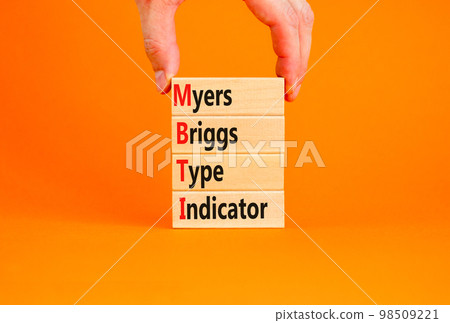 MBTI Myers Briggs type indicator symbol. Concept words MBTI Myers Briggs type indicator on block on beautiful orange background. Psychological MBTI Myers Briggs type indicator concept. Copy space 98509221