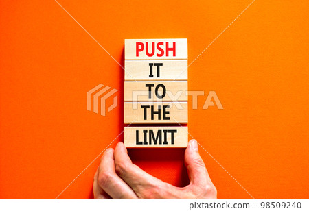 Push it to the limit symbol. Concept words Push it to the limit on wooden blocks. Beautiful orange table orange background. Businessman hand. Business push it to the limit concept. Copy space. Push it to the limit symbol. Concept words Push it to the limit on wooden blocks. Beautiful orange table orange background. Businessman hand. Business push it to the limit concept. Copy space. 98509240