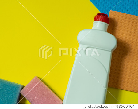cleaning stuff on yellow background cleaning stuff on yellow background 98509464