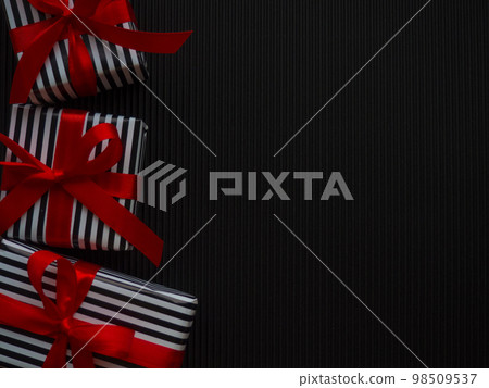 Gifts on the black background 98509537