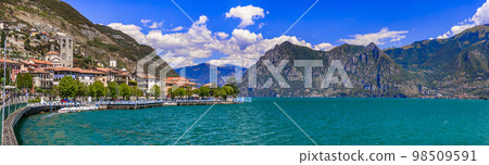 Romantic beautiful lake Iseo, aerial view of Riva di Solto- idyllic village surrounded by mountains. Italy , Bergamo province. 98509591