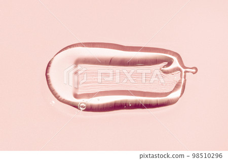 Close up of Serum drop texture. Clear liquid gel with bubbles drop isolated on pink background. Transparent cosmetic skincare product Close up of Serum drop texture. Clear liquid gel with bubbles drop isolated on pink background. Transparent cosmetic skincare product 98510296