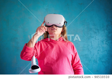 little girl playing with VR glasses little girl playing with VR glasses 98510310