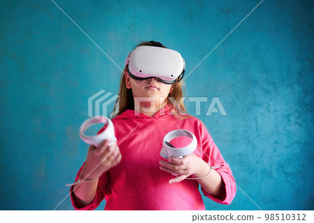 little girl playing with VR glasses little girl playing with VR glasses 98510312
