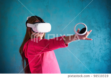little girl playing with VR glasses little girl playing with VR glasses 98510319
