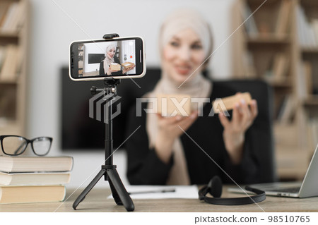Female blogger sharing her emotions with her subscribers in social networks. Female blogger sharing her emotions with her subscribers in social networks. 98510765