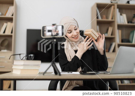 Female blogger sharing her emotions with her subscribers in social networks. 98510823
