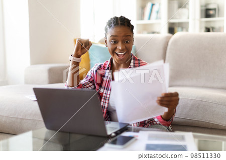 Emotional african american lady entrepreneur working from home 98511330