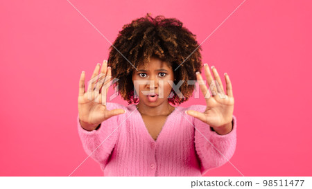 Angry sad confident millennial african american curly lady in casual show hands stop sign Angry sad confident millennial african american curly lady in casual show hands stop sign 98511477