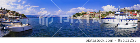 Greece, Corfu ionian island. view of Kassiopi traditional fishing village Greece, Corfu ionian island. view of Kassiopi traditional fishing village 98512253