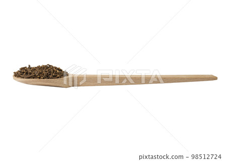Valerian herb root on wooden spoon isolated on white background. Valeriana officinalis. used in herbal medicine as a tranquillizer and to treat insomnia, anxiety, hypertension, pain relief. 98512724