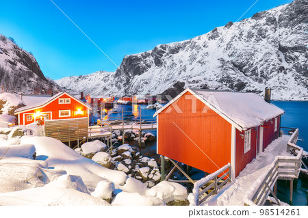 Fabulous evening seascape of Norwegian sea and cityscape of Nusfjord village. 98514261