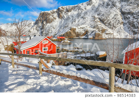 Amazing morning seascape of Norwegian sea and cityscape of Nusfjord village. Amazing morning seascape of Norwegian sea and cityscape of Nusfjord village. 98514383