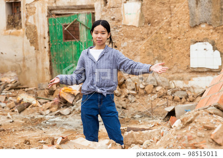 Girl is standing in ruins Girl is standing in ruins 98515011