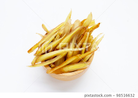 Sliced finger root on white background. Sliced finger root on white background. 98516632