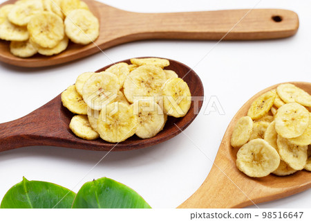Banana slice chips on white background. 98516647