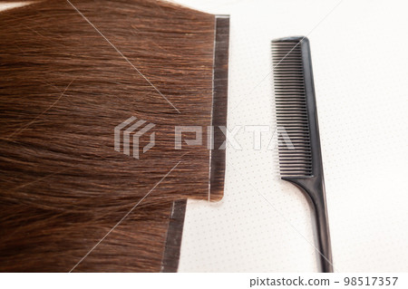 The process of preparing a hair ribbon for extension at home. The process of preparing a hair ribbon for extension at home. 98517357