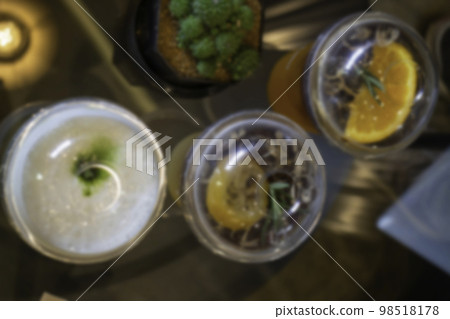 Glass of americano mixed with craft soda and yuzu orange juice blur background 98518178