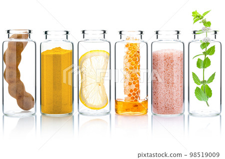 The glass bottle of homemade skin care and body scrubs with natural ingredients aloe vera ,himalayan salt ,peppermint ,rosemary ,turmeric and honey isolate on white background. 98519009