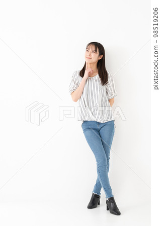 Thinking woman full body portrait Thinking woman full body portrait 98519206