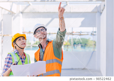 engineer worker team builder working together teamwork talking together work at construction site 98522462