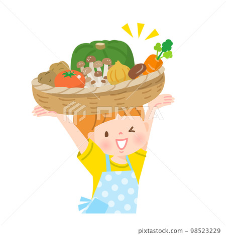 A boy carrying vegetables in a basket 98523229