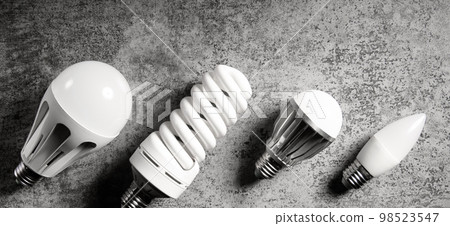 Electric lamps with different technology - diffirent led, luminescent and incandescent lamp. Top view 98523547