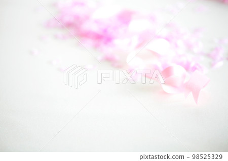 Spring graduation, new school, new member of society, celebration image, cherry blossom petals and ribbon 98525329