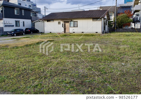 grassy vacant lot 98526177