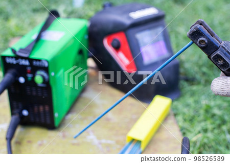 Welding machine, resistance seam welding electrodes and welding mask. The concept of services of a welder, the cost of welding work and safety. 98526589