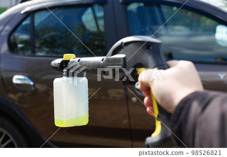 Nozzle foam generator for a sink of a high pressure. car chemicals, shampoo concentrate. Car care. copy space for text Nozzle foam generator for a sink of a high pressure. car chemicals, shampoo concentrate. Car care. copy space for text 98526821