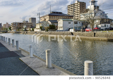 Beautiful columnar stones lined up on the side of the road along the river Beautiful columnar stones lined up on the side of the road along the river 98526848