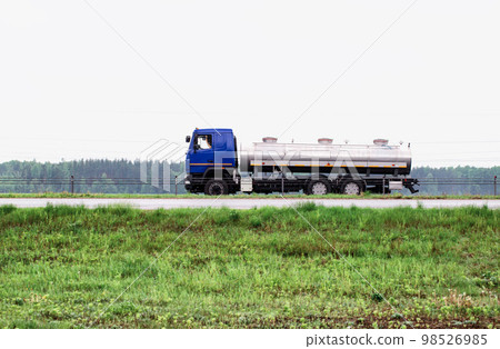 Truck milk tanker transports milk on the highway. Farming, copy space for text. Industry Truck milk tanker transports milk on the highway. Farming, copy space for text. Industry 98526985