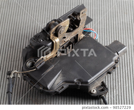 Car electric door lock, close-up. Limit switch failure, automotive part. Car electrical repair, close-up 98527229