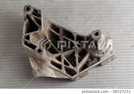 Aluminum pad and car engine mount, close-up 98527231