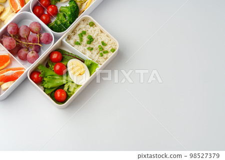 Healthy food delivery in take away box on white background Healthy food delivery in take away box on white background 98527379