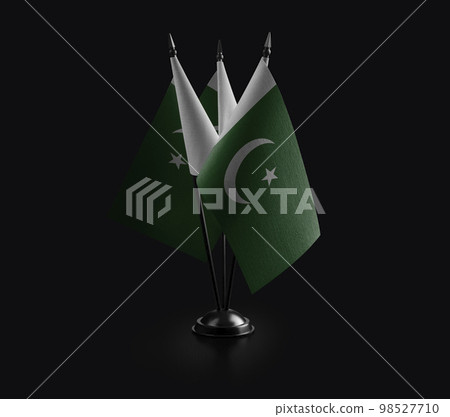 Small national flags of the Pakistan on a black background Small national flags of the Pakistan on a black background 98527710
