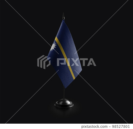 Small national flag of the Nauru on a black background 98527801