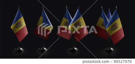 Small national flags of the Moldavia on a black background 98527870